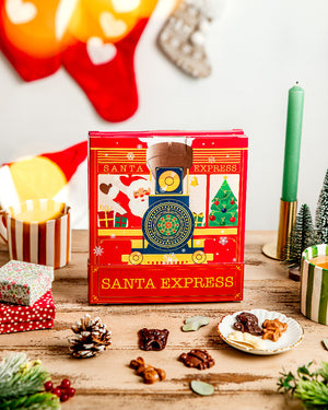 Calendrier de l'Avent Santa Express, il contient des fritures en chocolat noir, au lait et blanc vegan réalisé par Végéta'Ly